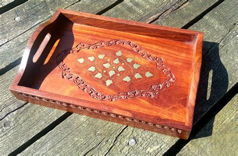 Small wooden serving tray with brass inlaid detail. - The Camphor Tree