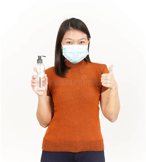 Wearing Medical Mask And Holding Hand Sanitizer Of Beautiful Asian