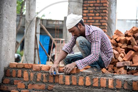 Image Of Indian Rural Construction Workers Working Developing A Site By