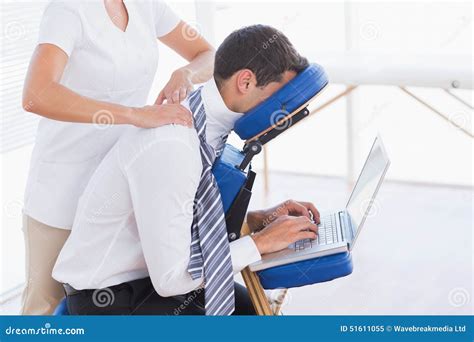 businessman having back massage while using laptop stock image image of people patient 51611055