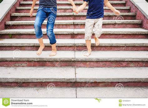 Children Rushing Down On Stairs Barefoot Stock Image - Image of legs ...