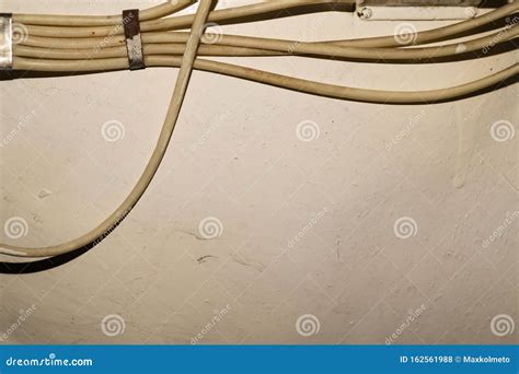 Electrical Wires Or Cables Hanging On Wall Industrial Background Stock
