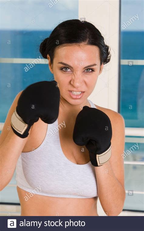 Portrait Of A Young Woman Wearing Boxing Gloves Stock Photo Alamy