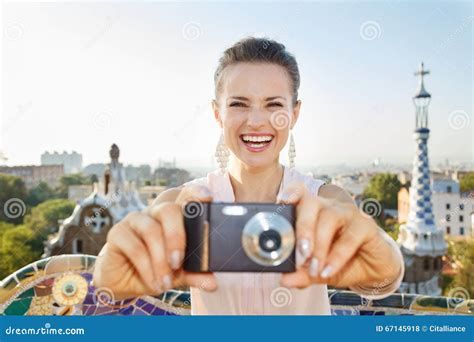 Woman Tourist Taking Photo With Photo Camera In Park Guell Stock Photo