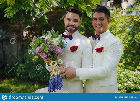 Lgbt Gay Bride And Groom With Flower Bouquet In Wedding Ceremony Stock