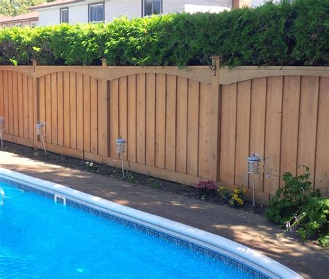 This fence has a size that is not. Wooden Fences » Tropical Touch Landscaping