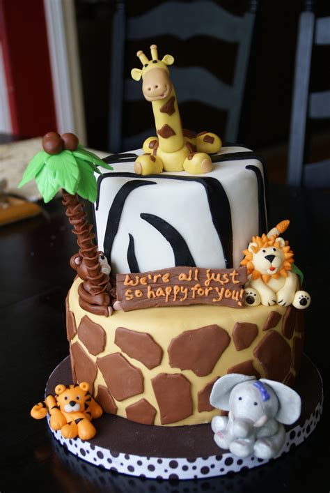 This charming white ruffle cake looks dreamy with the plastic animals on top. Safari Theme Baby Shower - CakeCentral.com