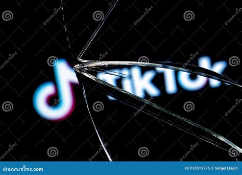 Logo Of The Tiktok Social Network In The Reflection Of A Broken Mirror
