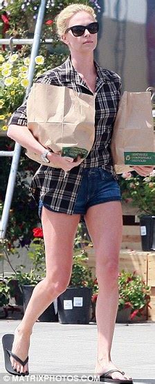 Charlize Theron Shows Off Her Fabulous Legs In A Pair Of Denim Hotpants
