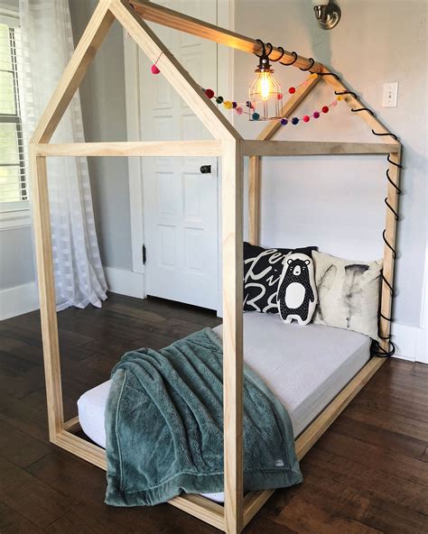 Want to create the perfect diy house frame floor bed? DIY Toddler House Bed - The Okie Home