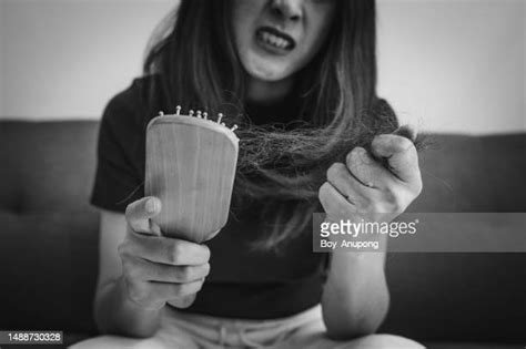 Brushing Hair Pain Photos And Premium High Res Pictures Getty Images