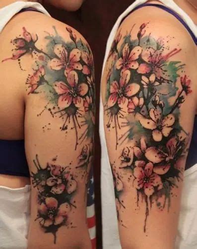 The Back Of A Womans Shoulder With Flowers Painted On It And Watercolor