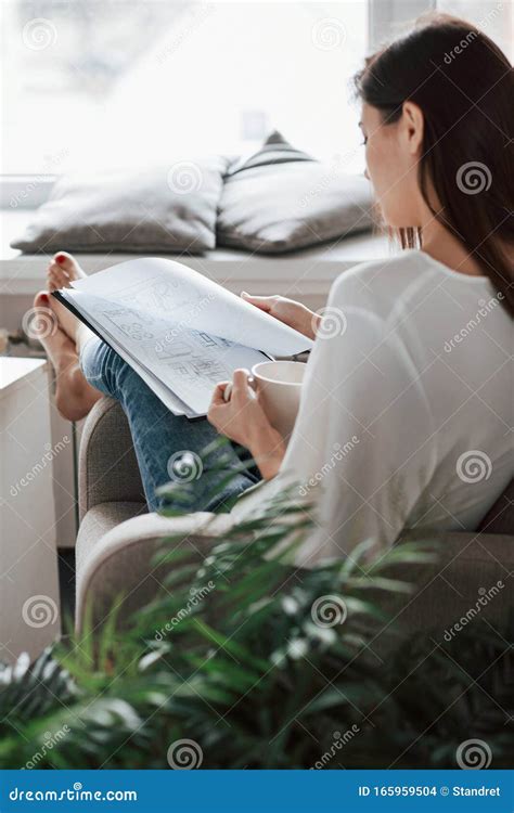 Calm And Quiet Atmosphere Young Brunette In The Room With White Walls