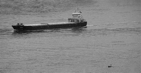 Grayscale Photography Of Cargo Ship Sailing On The Sea · Free Stock Photo