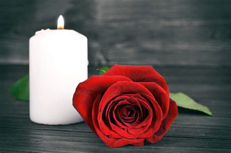 Memorial Candle And Rose On Wooden Background High Swartz Llp