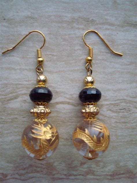Furthermore, the earrings designed by toriyama are similar to a traditional tibetan drop earring, which have a spherical shape embedded in a cap. Dragon Ball Earrings Crystal Quartz Etched Dragon Earrings ...