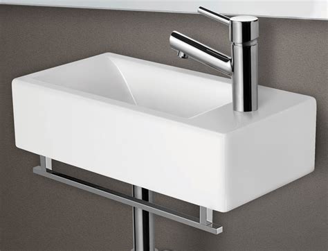 The edge lip of the sink is mounted below a solid surface countertop, so the sink effectively hangs underneath the counter, as opposed to sitting on top of it; Small Wall Mount Sink - HomesFeed