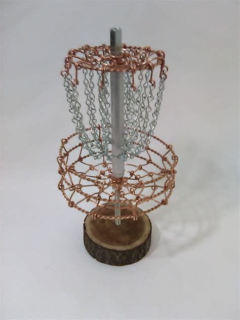 This metal disc golf basket stands 52 tall, with a stable base diameter of 23.5 and 24 galvanized chains. Copper Disc Golf target functional trophy bottle cap disc ...