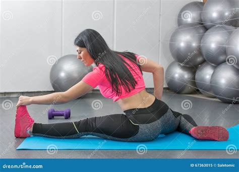 brunette stretching on a mat stock image image of adult brunette 67363015