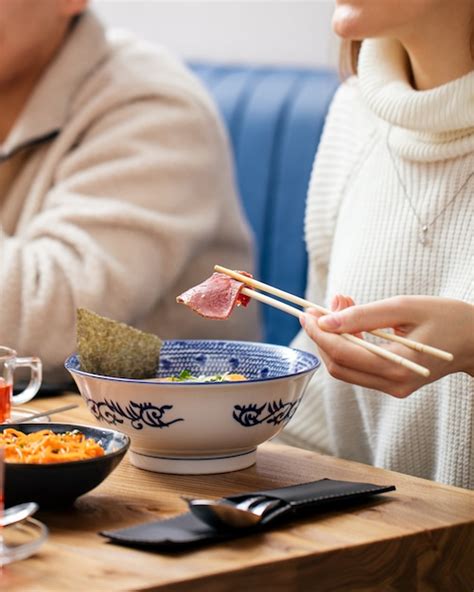 Premium Photo Woman Eating Japanese Ramen Noodle Soup With Chopsticks