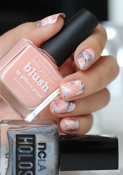A glittery pink accent nail on the pinky fingernail of this manicure amps up the glam factor and continues it throughout the look with some pink glitter polish detailing. 28 Marble Nail Designs For An Elegant And Strong Look ...