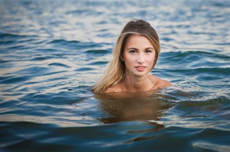 Young Blonde Woman Swimming In Ocean With Perfect Hair And Stock Image Image Of Health