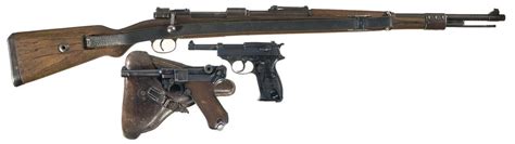 Three German Military Guns With Military Related Items