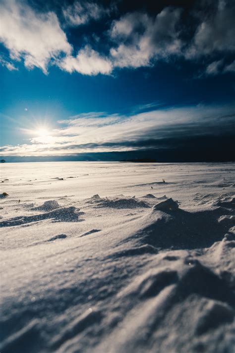 картинки море берег песок горизонт гора снег зима облако небо солнце Восход закат