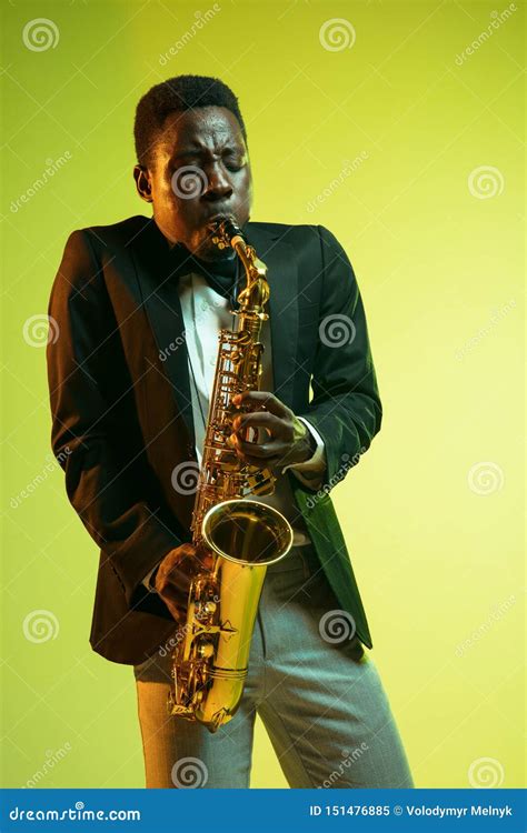 Young African American Jazz Musician Playing The Saxophone Stock Image