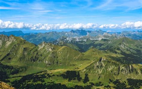 Greenery Hills Trees Valley Mountains Slope Under White Clouds Blue Sky