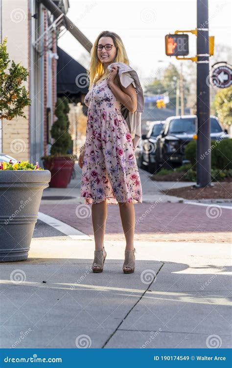 A Lovely Blonde Model Enjoys An Autumn Day Outdoors In A Small Town Stock Image Image Of