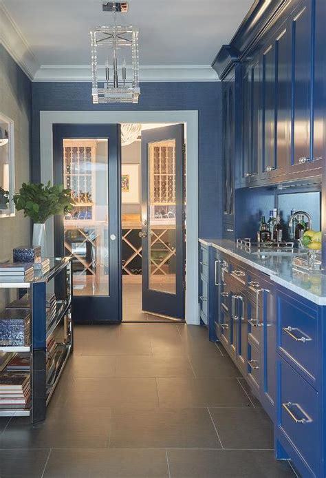 Glossy Blue Butlers Pantry Cabinets With Mirrored Backsplash