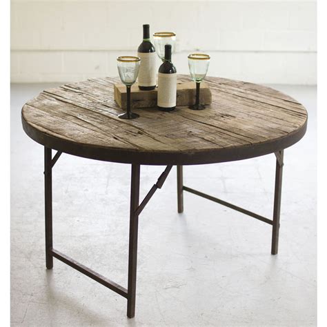 Pieces of reclaimed wood form a richly grained mosaic on this coffee table. Reclaimed Wood Folding Round Table