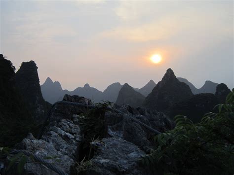 Sunset Over The Mountains Of Guilin China Rimagesofchina