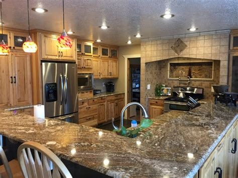 In many homes a bright white color on the kitchen cabinets can be too bright. Should I paint my hickory cabinets white?