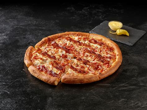 papa john s new pizza is covered in full strips of bacon