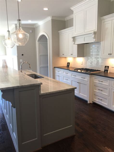 This light color will brighten up your kitchen and add a touch of warmth without yellow undertones. Alabaster White Kitchen Cabinets