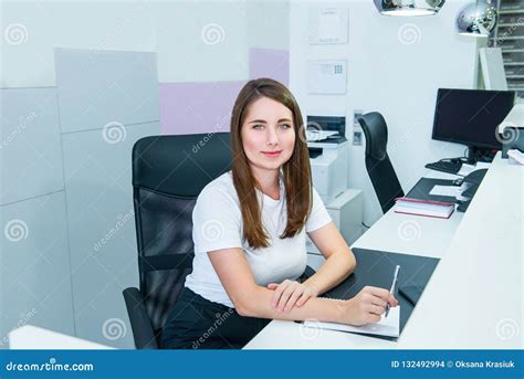 Portrait Of Skilled Administrative Manager Sitting On Her Office