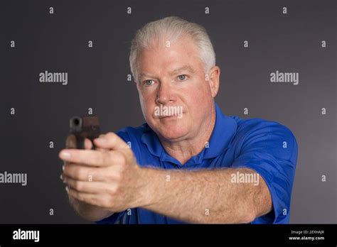 Serious Man Holding Pistol Pointing Hi Res Stock Photography And Images