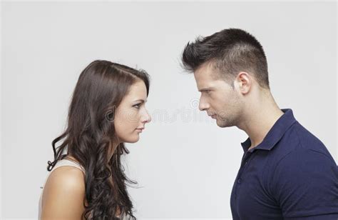 Couple Pushing Their Heads Against Each Other Stock Photo Image Of