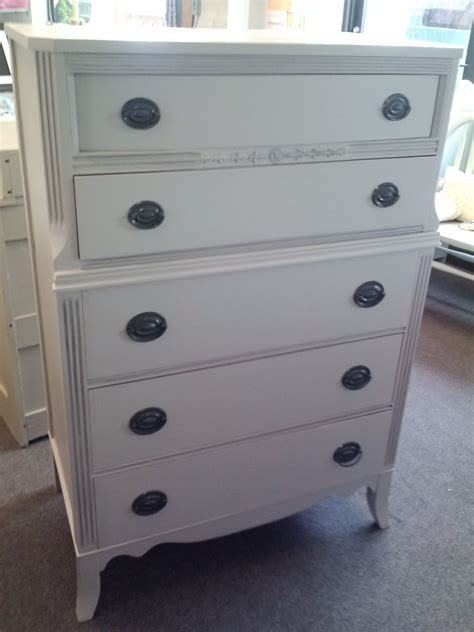 Crafted from engineered wood, this design showcases five sleek drawer fronts, which are each accented by two understated metal knobs. $325.00 Tall dresser with 5 deep drawers painted gray with ...