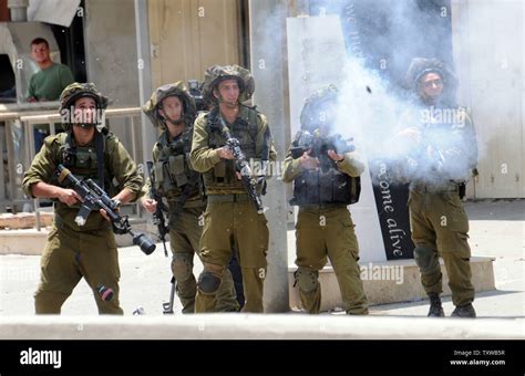 Israeli Soldiers Fire Tear Gas During Clashes Stone Throwing