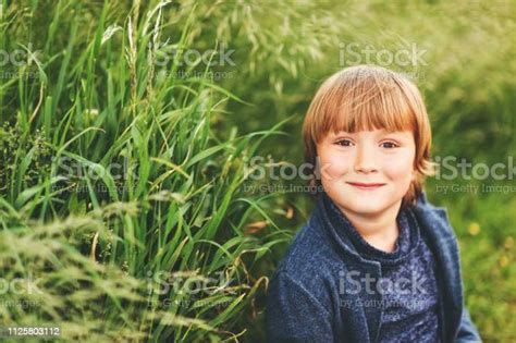 Outdoor Portrait Of Adorable 6 Year Old Kid Boy Stock Photo Download