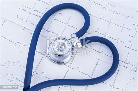 Heart Formed Stethoscope Against Background Of Electrocardiogram Head