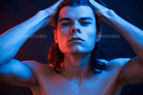 Shirtless Guy Studio Shot In Dark Studio With Neon Light Portrait Of