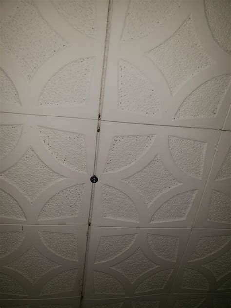 Cut the corner tile and. Anyone know what kind of ceiling tiles these are? Adhesive ...