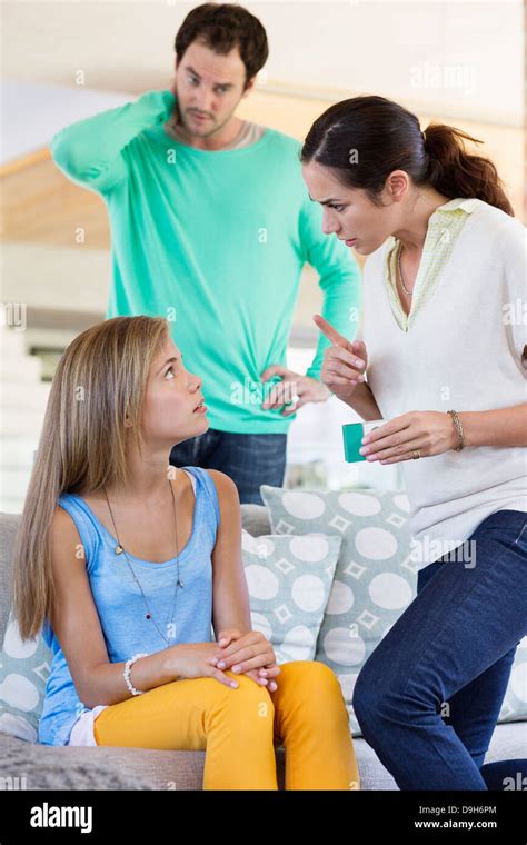 Parents Scolding Their Daughter At Home Stock Photo Alamy