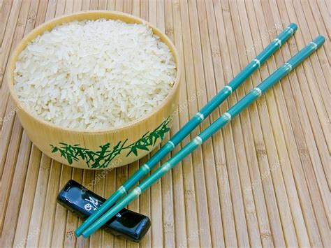 Check spelling or type a new query. Wooden bowl with rice and chopsticks — Stock Photo © IngridsI #2347138