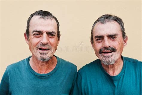 Senior Twin Men Smiling On Camera Focus On Faces Stock Image Image