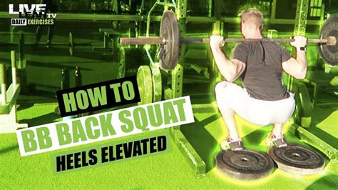 how to do a barbell back squat with heels elevated exercise demonstration video and guide